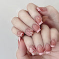 Pink butterfly reusable press-on nails by Nailed It
