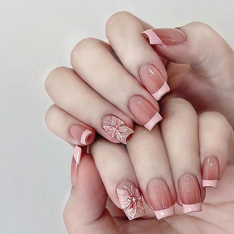 Pink butterfly reusable press-on nails by Nailed It
