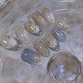 Silver star glossy reusable press-on nails by Nailed It