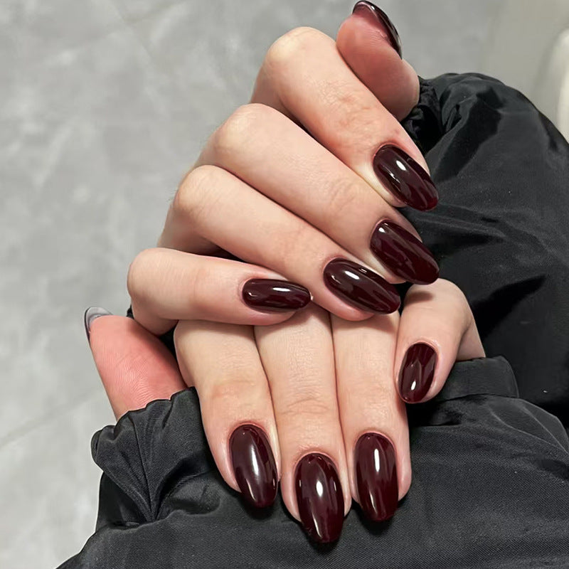 Dark red glossy reusable press-on nails by Nailed It
